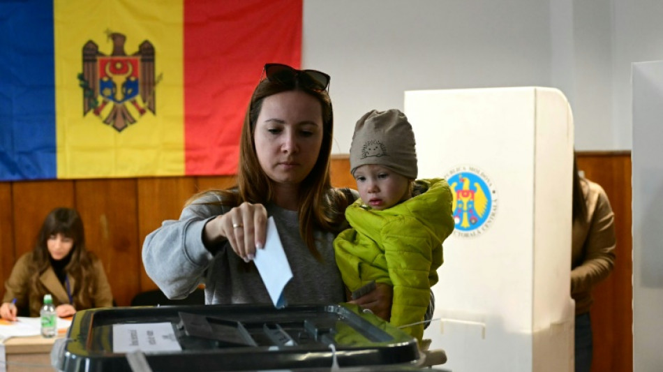 Moldova votes in tense polls, torn between EU and Russia