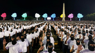 Accused of repression, Nicaragua's Ortega swears in hooded 'volunteer' force